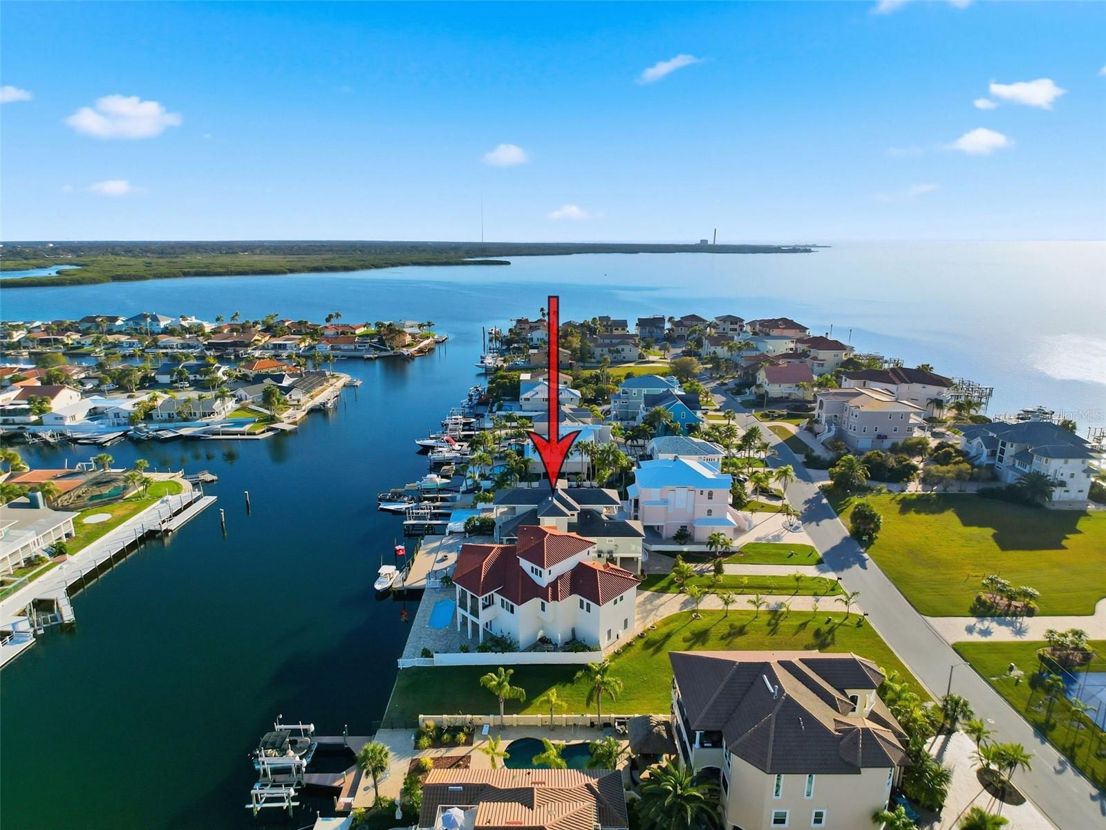 Aerial view highlighting the home’s prime waterfront location with direct boating access to the Gulf, Anclote Island,