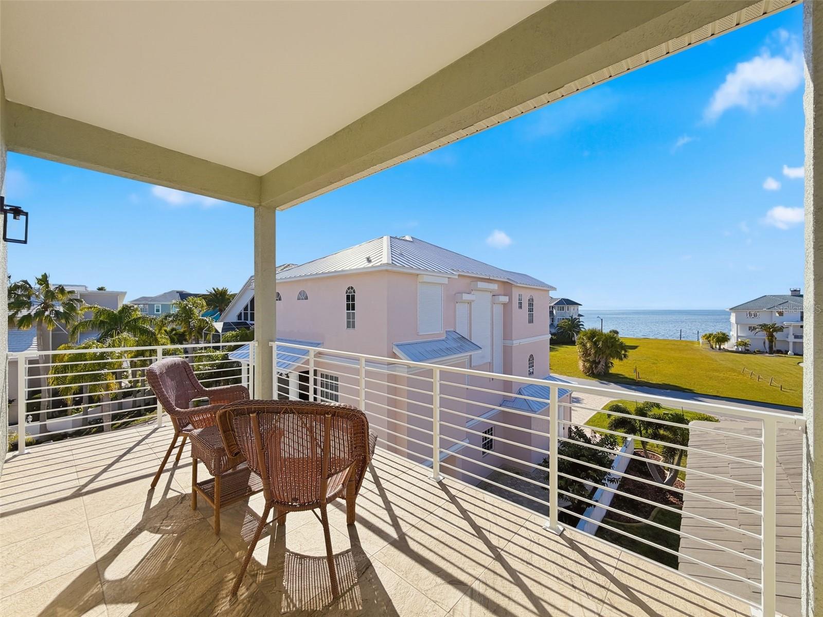 balcony with panoramic Gulf water views.