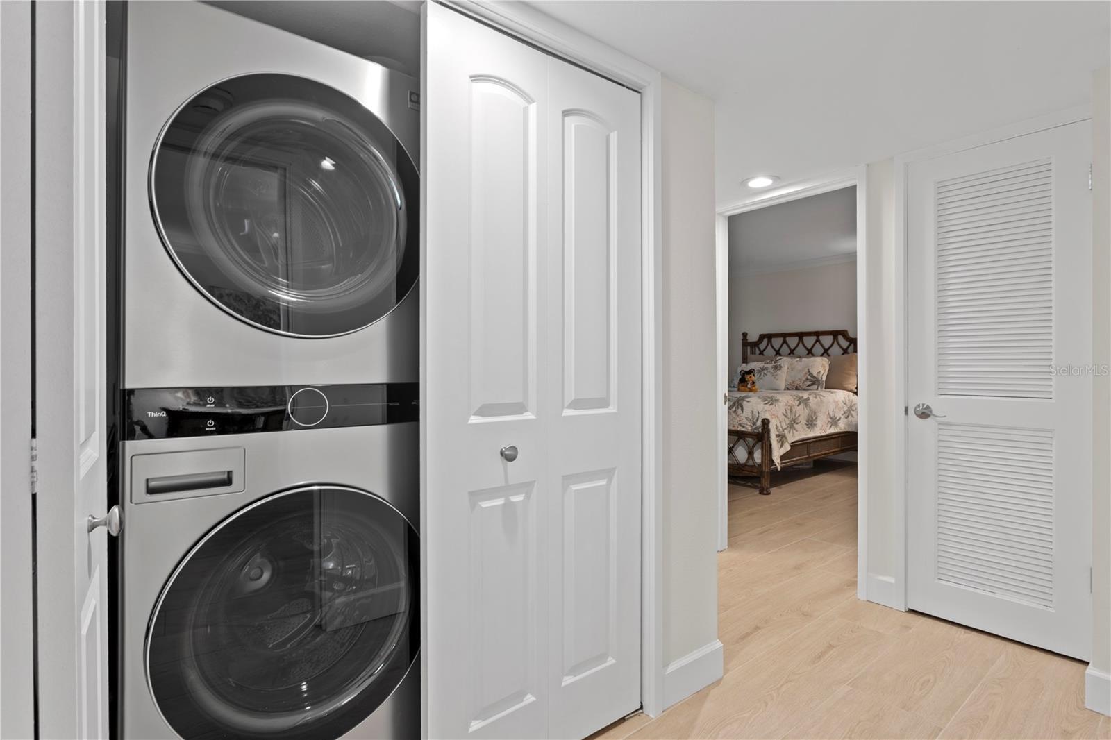 In residence laundry has been enhanced to provide full-size stackable washer/dryer and additional well-organized storage.
