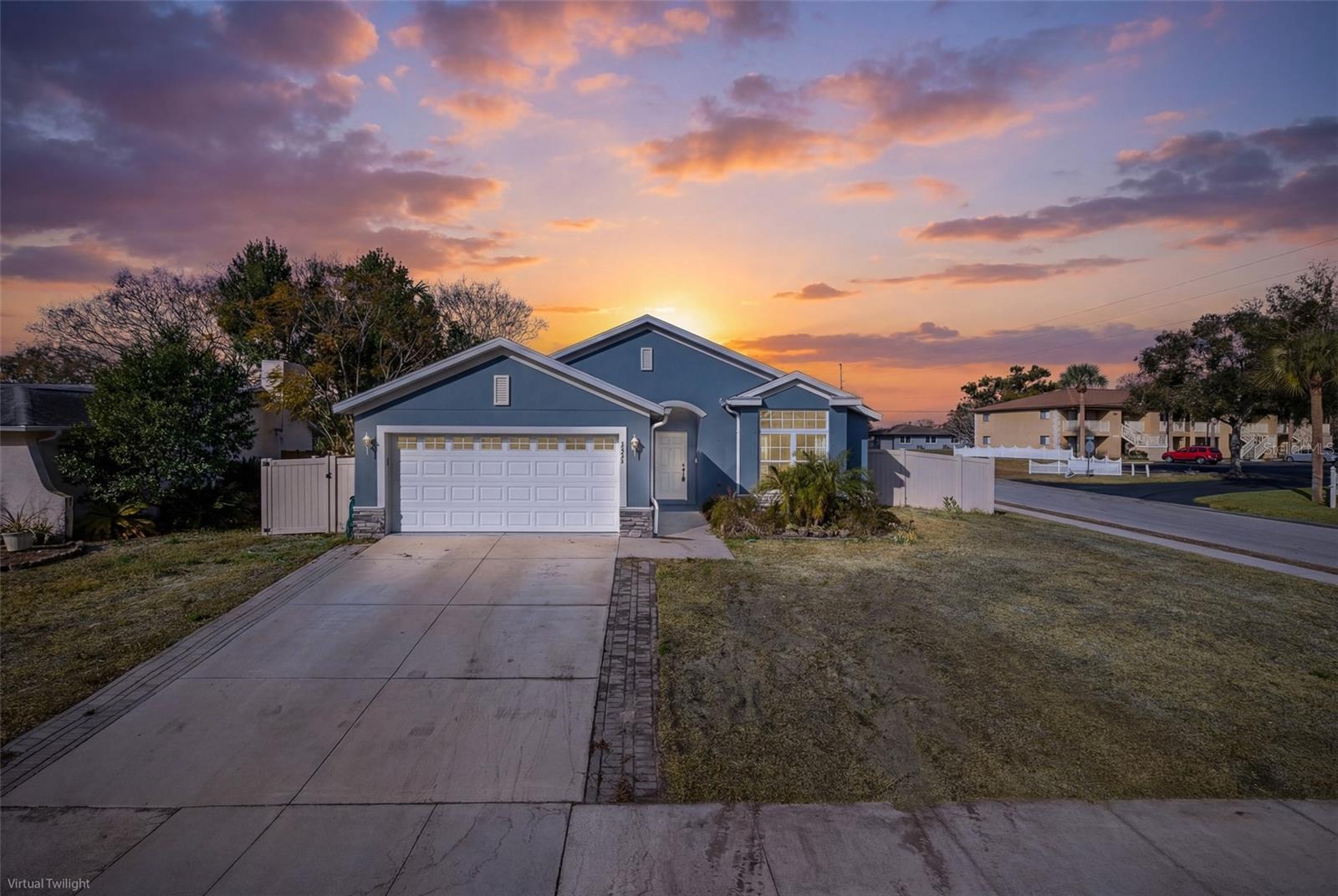 FRONT OF HOME WITH SUNSET