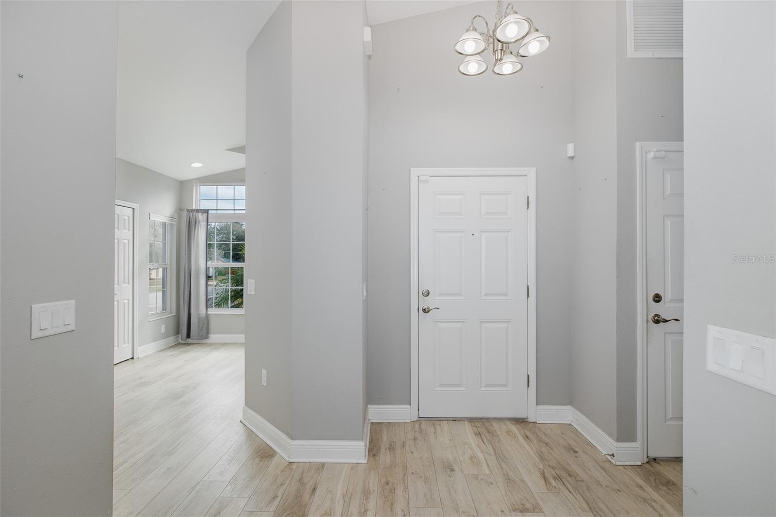 FRONT DOOR INTO KITCHEN/LIVING ROOM
