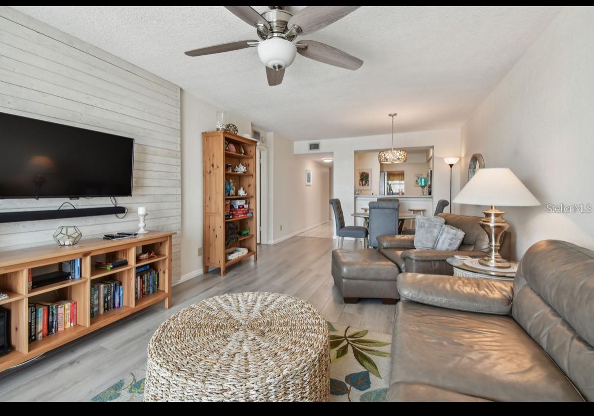 living room towards dining room and kitchen