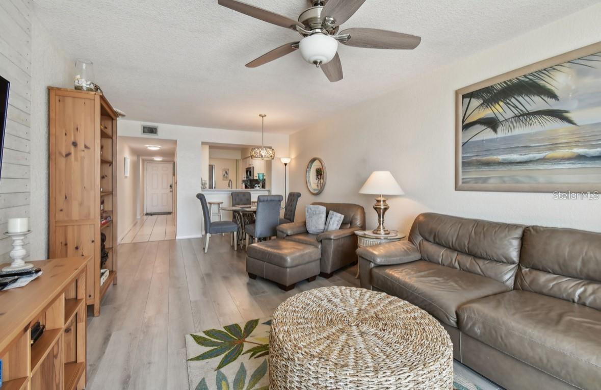 living room towards dining room and kitchen