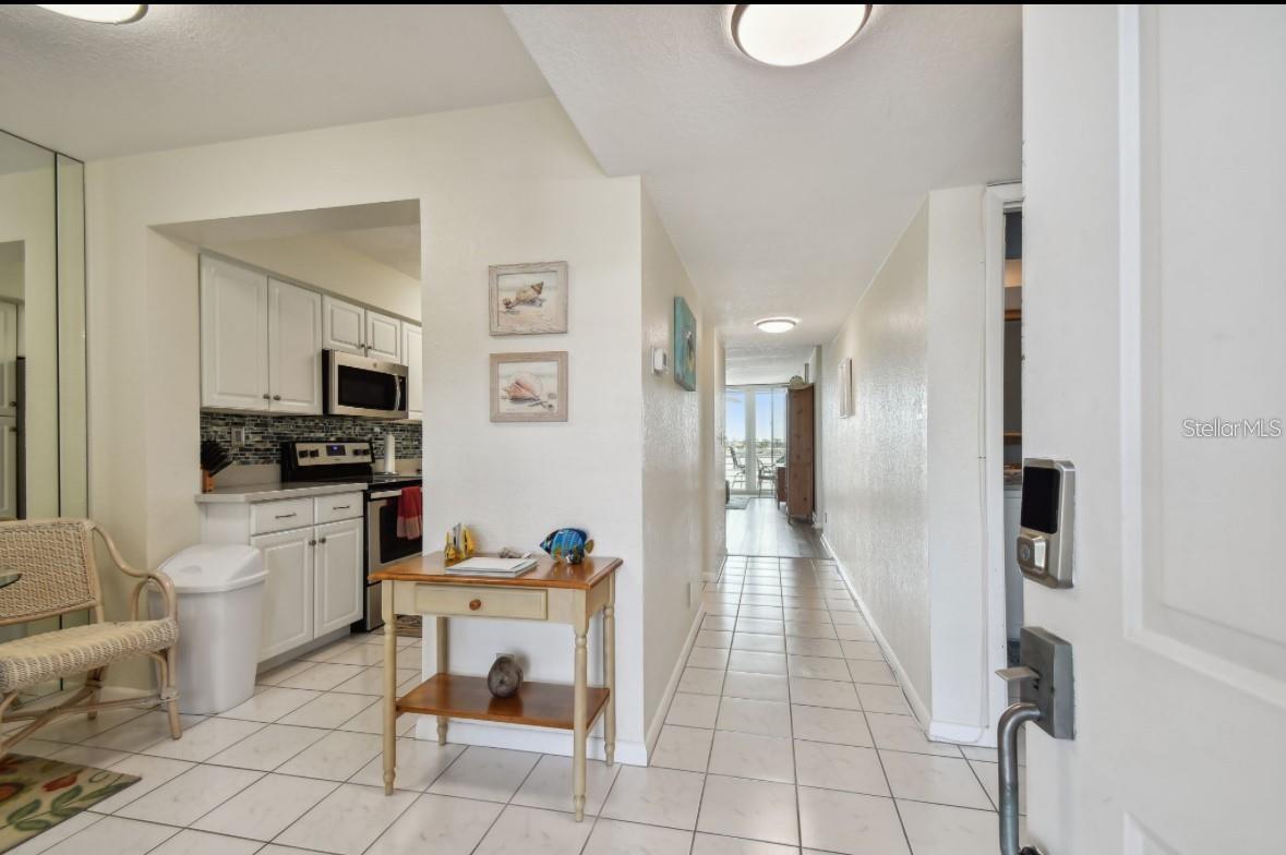 from front door with dinette on left looking through condo towards intracoastal