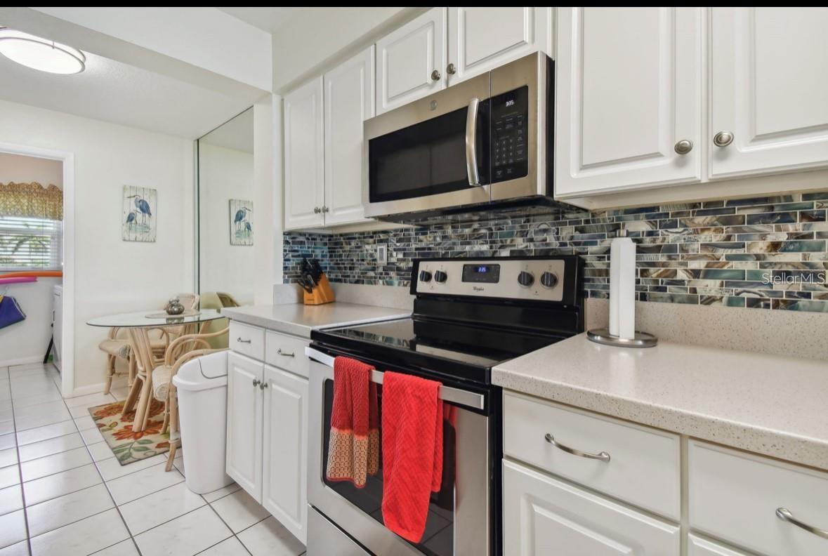 kitchen looking towards dinette area and door of laundry room