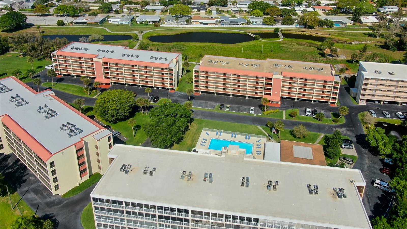 Unit 202  is located in Building C which is the middle of the 3 buildings in the rear of the photo