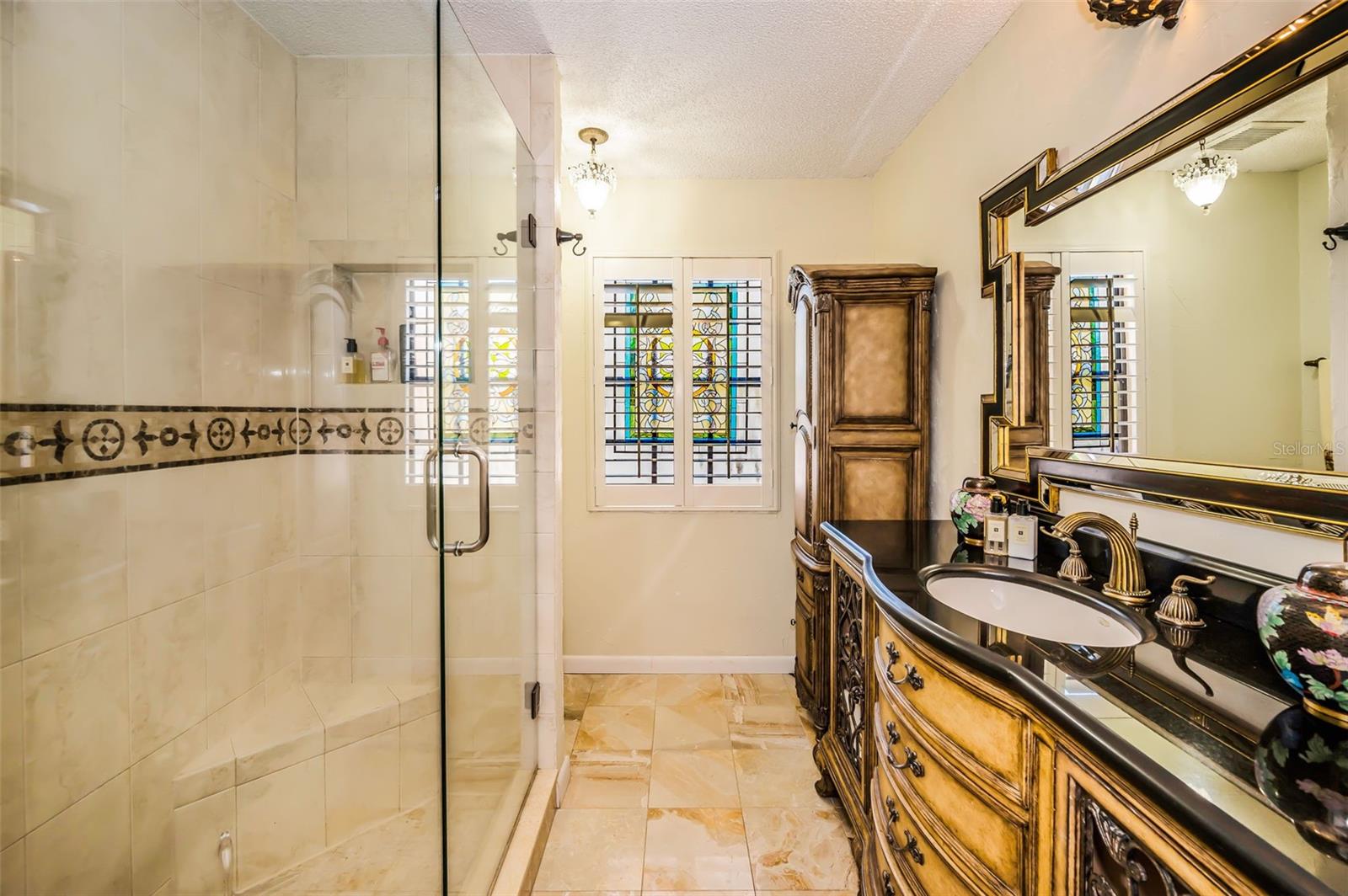 Primary ensuite walk in shower with glass enclosure