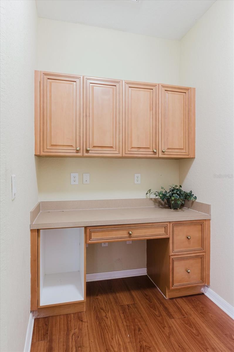 Office nook with built in desk off the side of living room