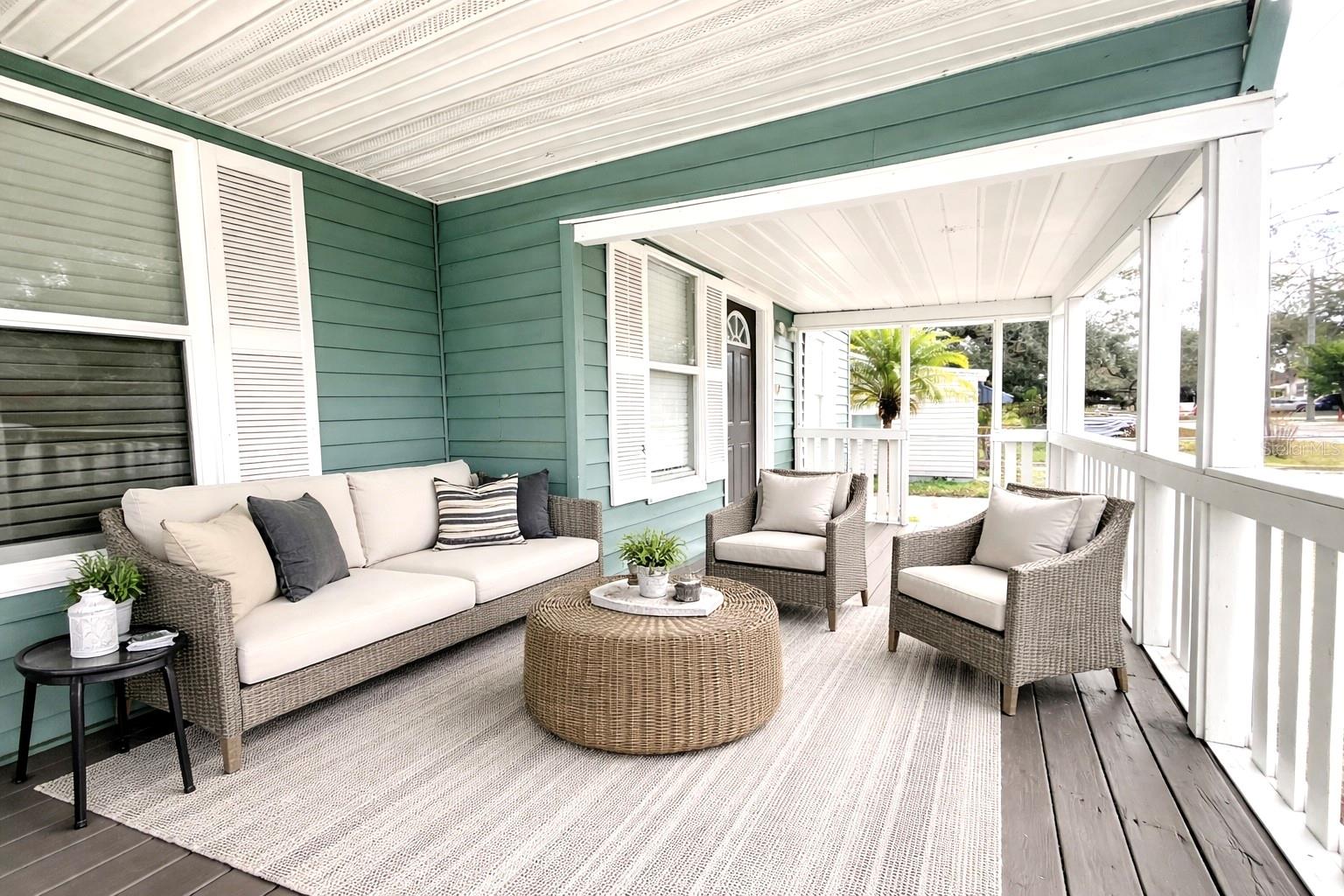 Front porch with railing, two convenient sets of steps.