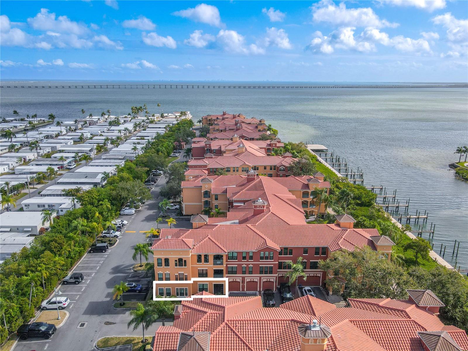 Aerial view of the 2 bedroom 2 bath den  first-floor condo in Grand Bellagio at Baywatch, Mediterranean-inspired architecture and a desirable corner-style placement, highlighting the location of the unit.