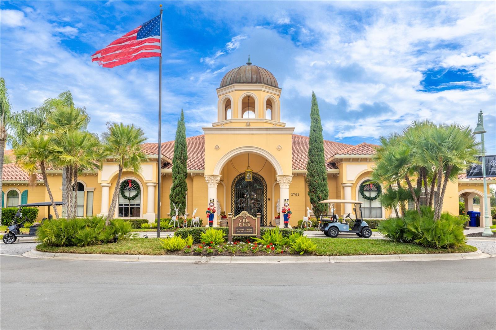 The impressive community clubhouse serves as the heart of the community, featuring a striking resort-style pool with dual sun-shelf basins and palm-framed lounge spaces perfect for unwinding or entertaining.