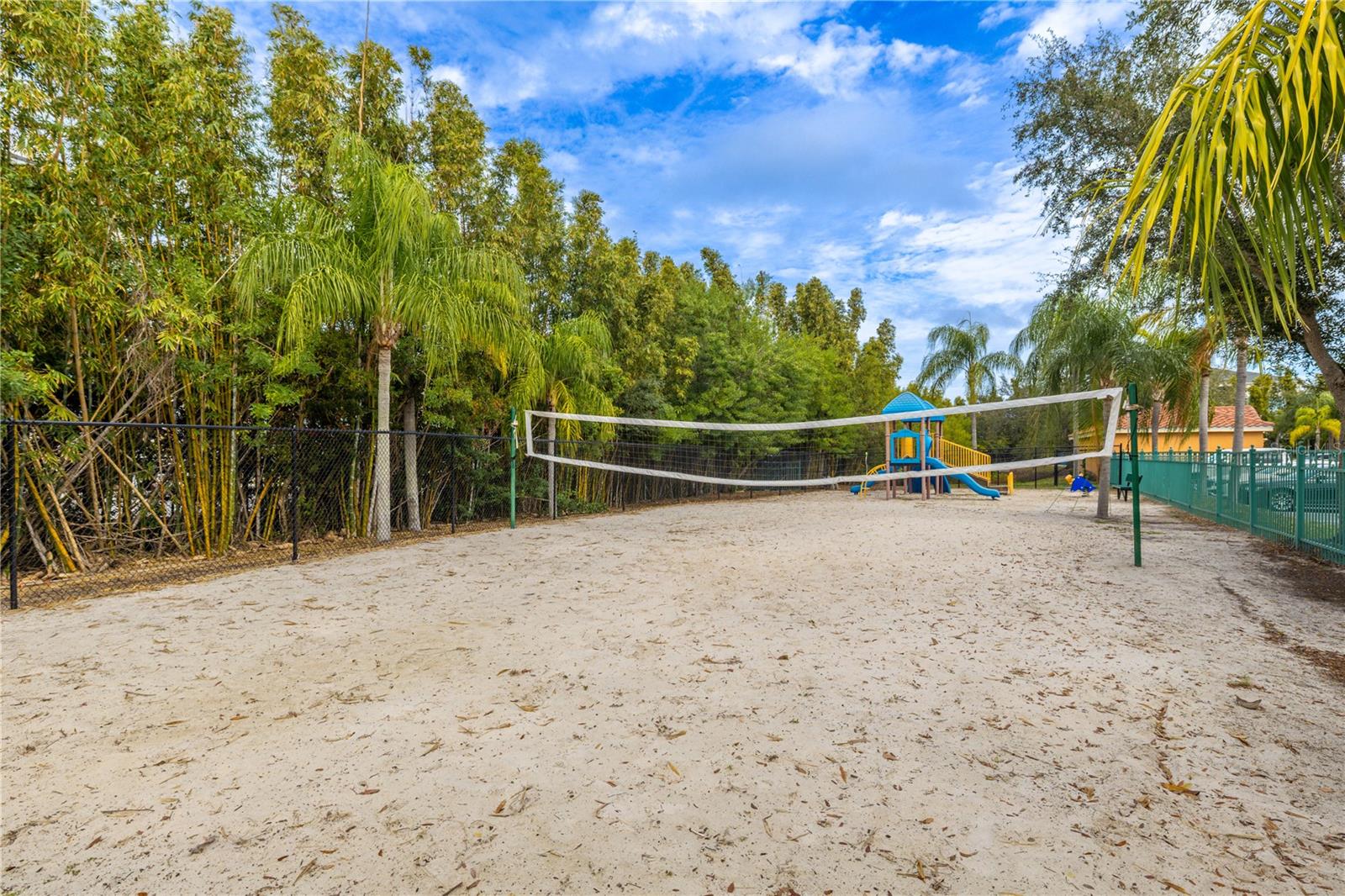 A ground view of the beach style community volleyball court.