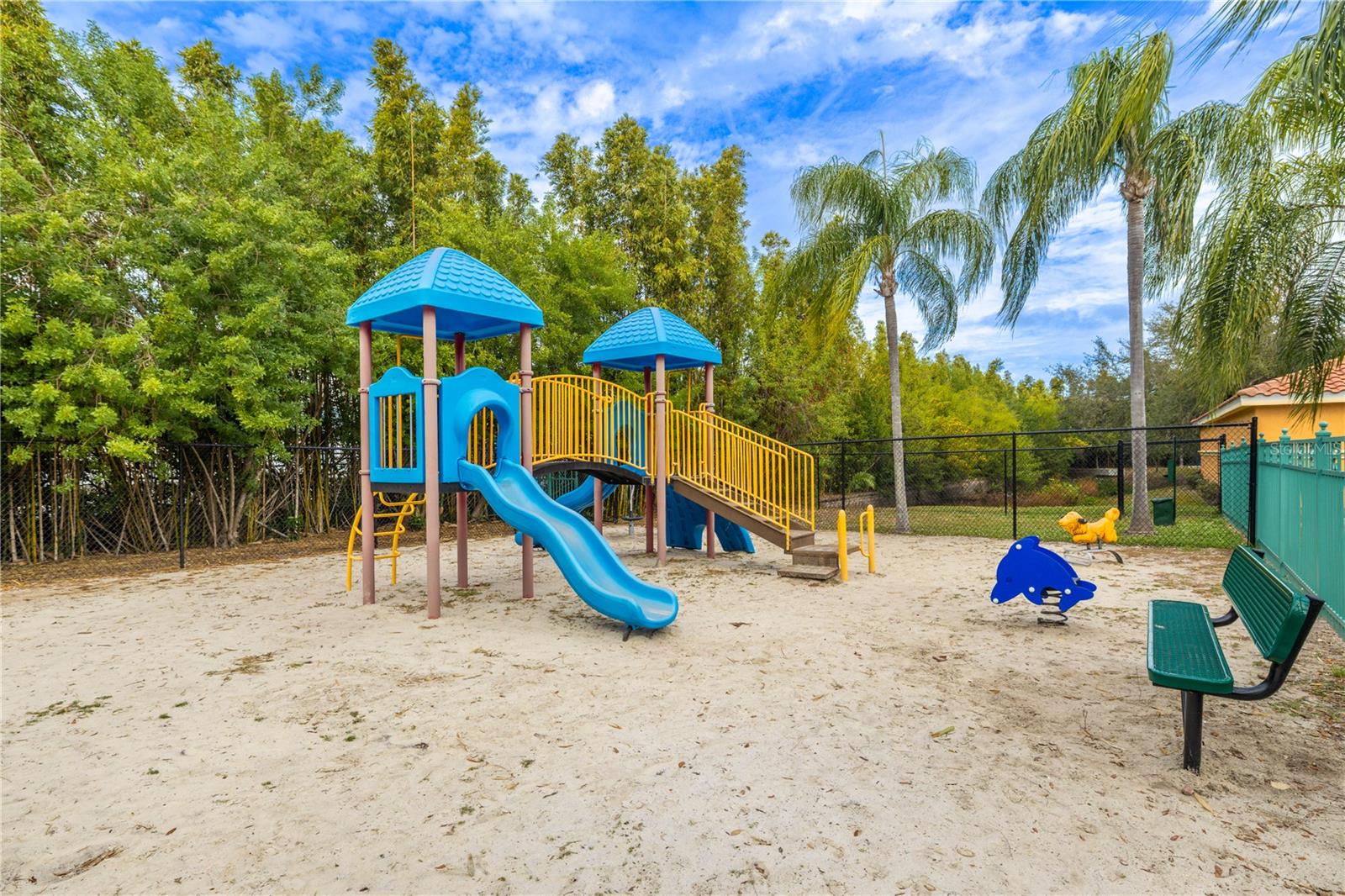 Enclosed community playground area providing extra security for your little ones.