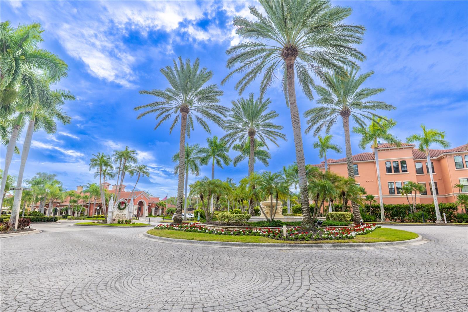 Beautiful tropical landscaped circular roundabout supports traffic flow to the various units.