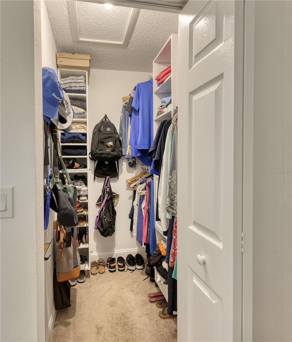 Primary Walk-in Closet with Built-in Shelving