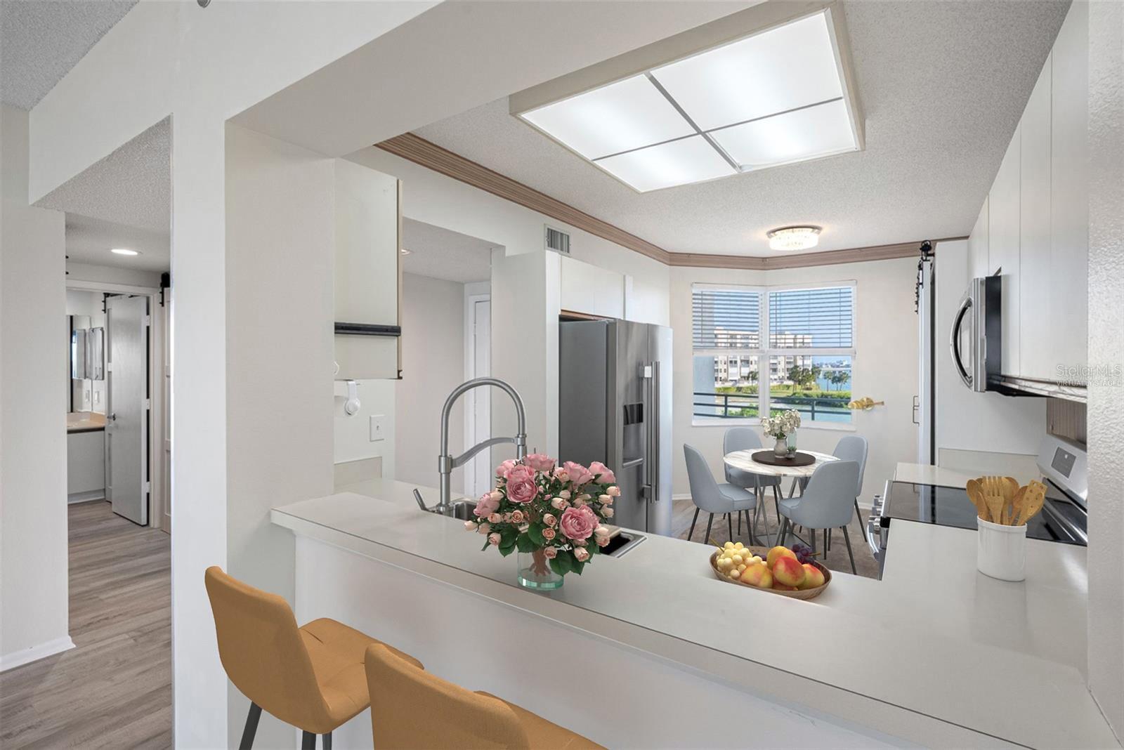 Virtually staged spacious kitchen, ample storage, beautiful water views in both directions front of condo and back back