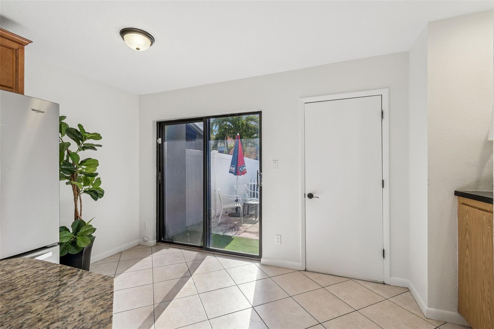 Cute courtyard off of kitchen area. New turf.