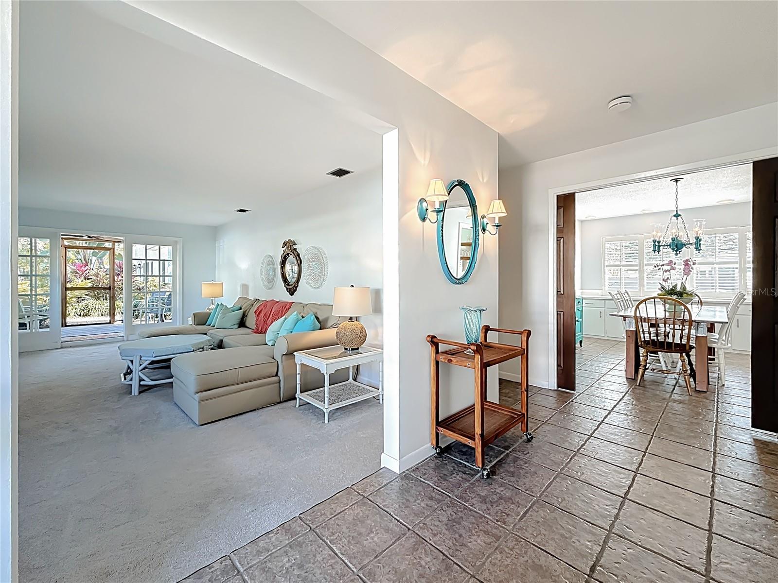 Split floor plan with formal living room and primary suite on one side.