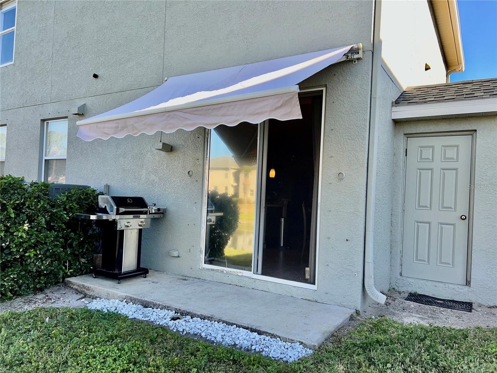 Rear patio and motorized awning