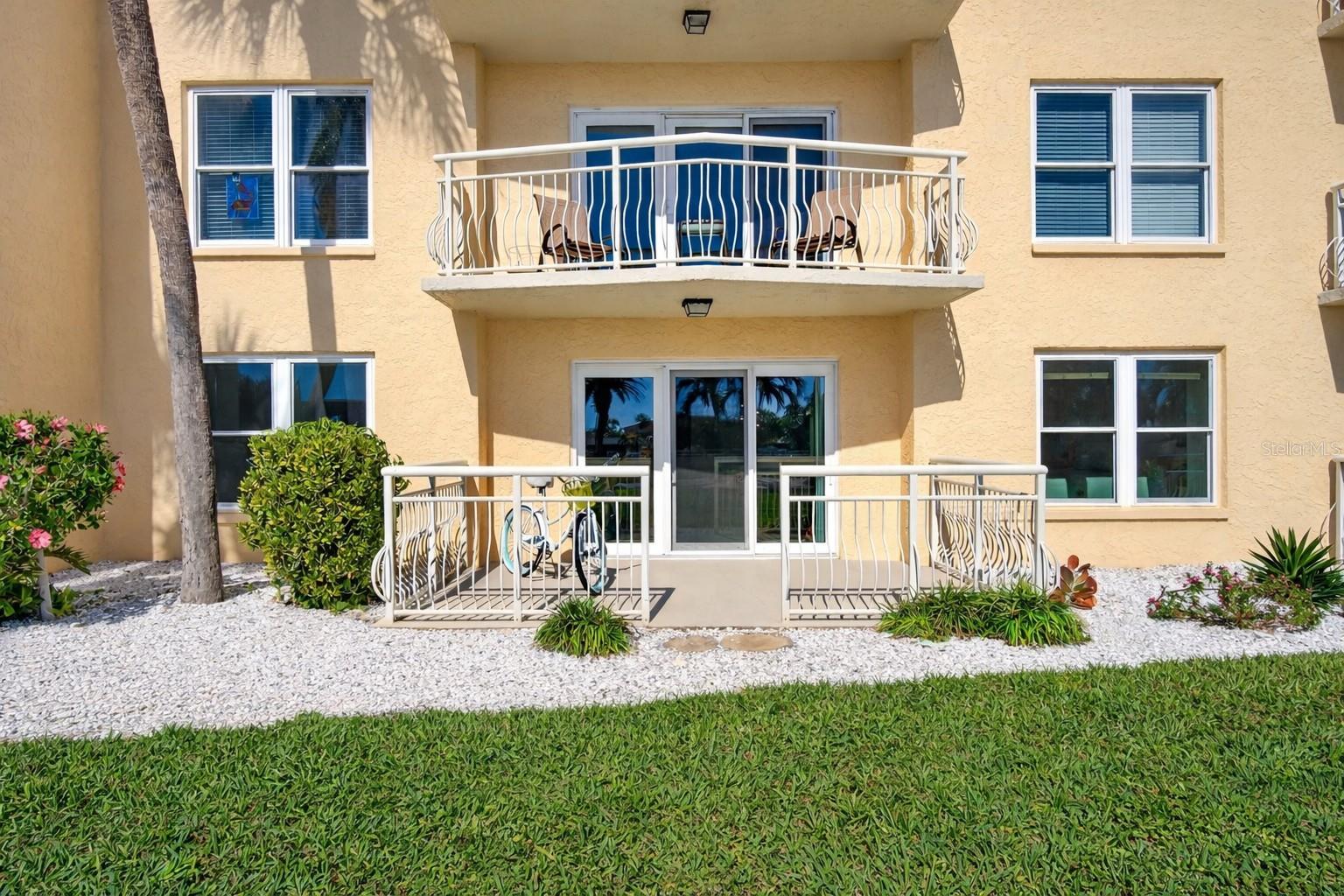 Effortless first-floor living with a private patio—skip the elevators and immerse yourself in the plush grounds and serene canal just steps away.