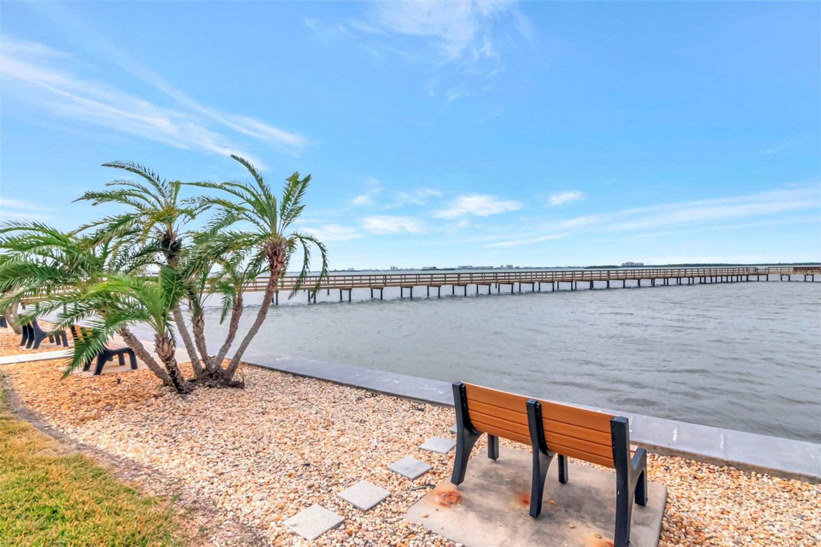 Common area near seawall with south pier on the left and Clearwater Beach in the background.