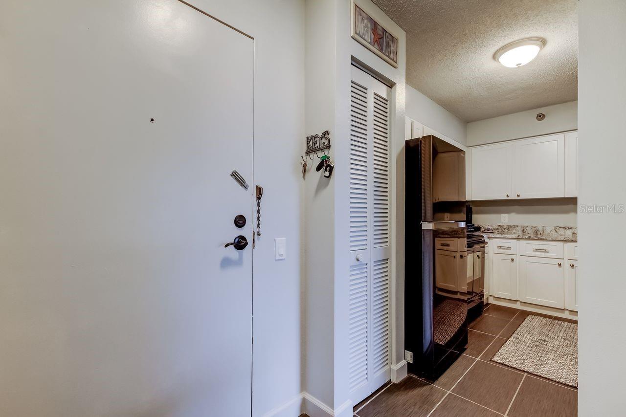 Front door and view of Pantry in kitchen