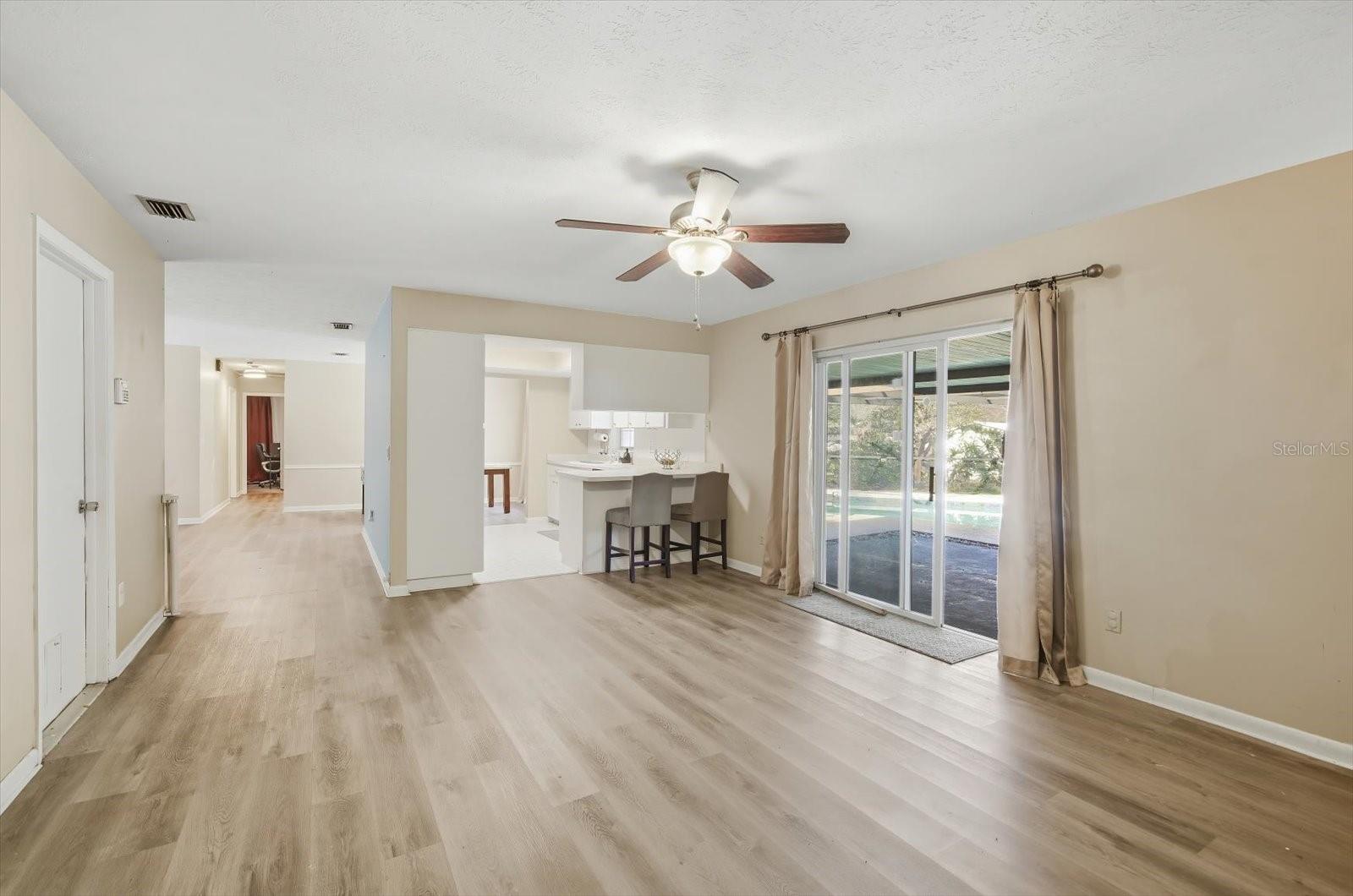 Family room overlooking pool and landscaping