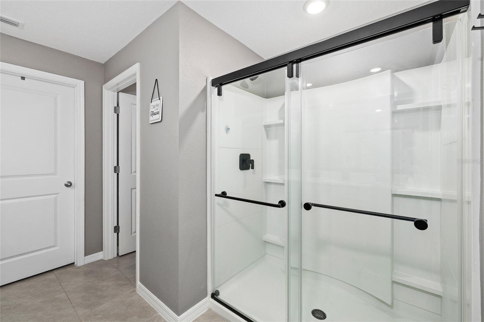 Primary Bathroom- shower with glass enclosures
