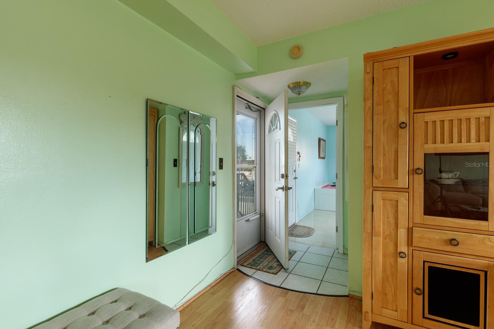 Front door & primary bedroom is behind it.