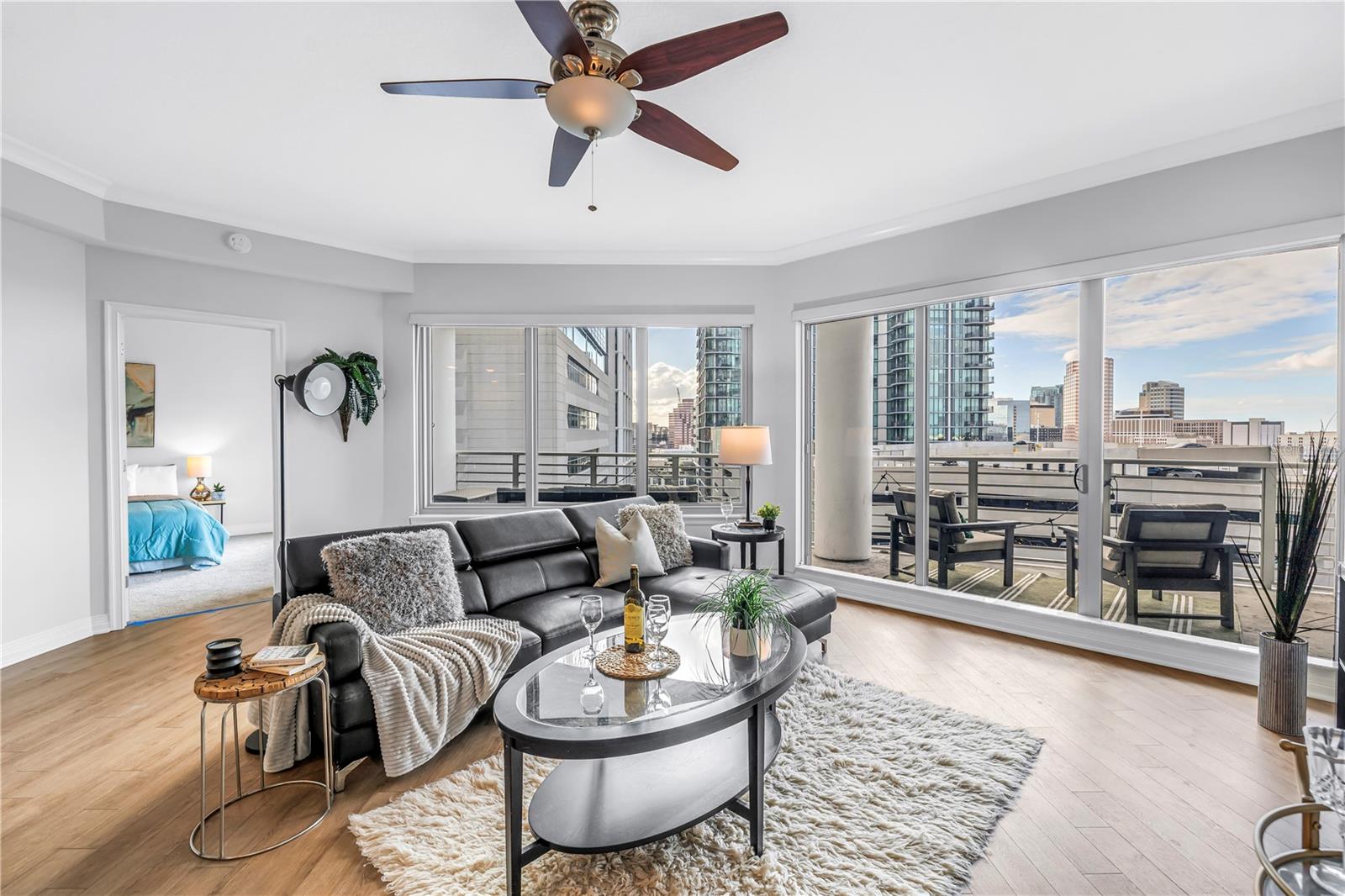 Large Open Living Space with Big Sliders to the Balcony Views of USF Med School and Modern Architectural Towers