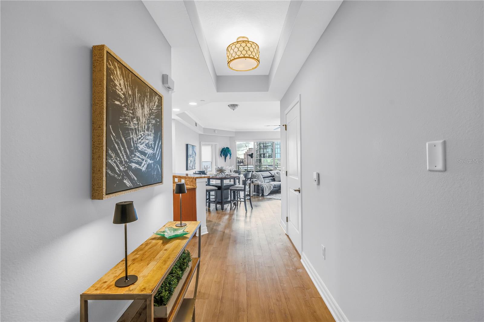 Sophisticated Hardwood Entry Opens the Double Doors to this Luxury 12th Floor Split Suite Enclave