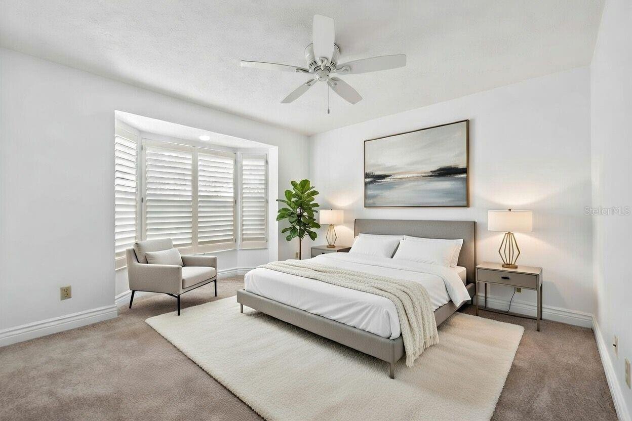 Guest suite with bay window (staged)