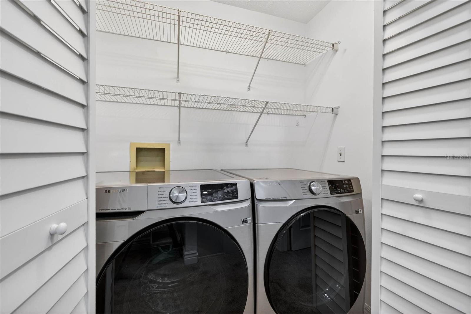 full size front-load washer & dryer (included) in upstairs closet