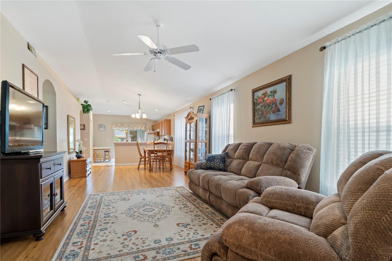 Open-concept living and dining area with a seamless flow, perfect for gatherings, family time, and comfortable daily living.