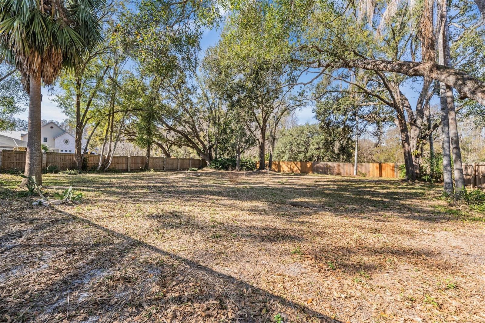 over half an acre of mature land