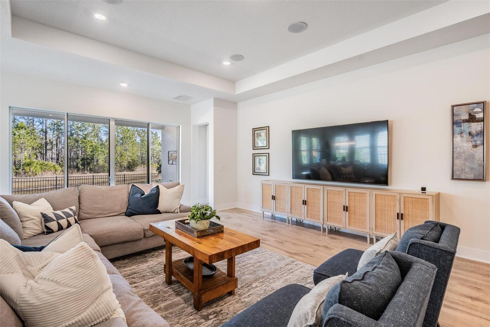 A neutral color palette takes the focus to the private backyard setting