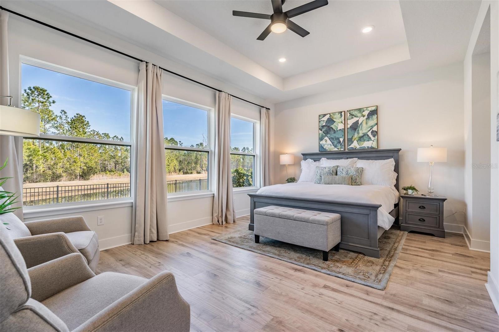 The master bedroom offers a bank of windows to welcome the day!
