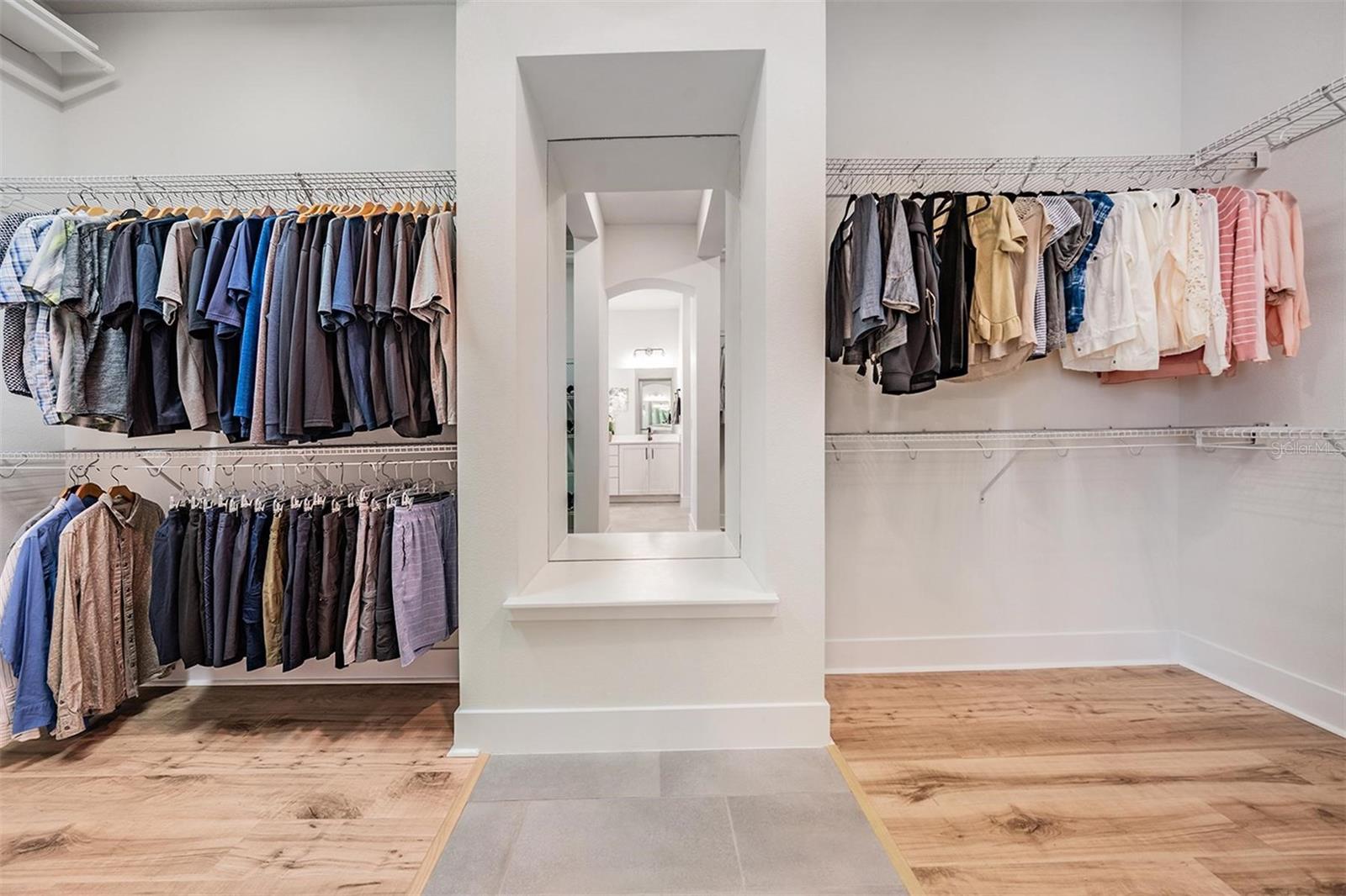 Walk-in closet adjoins master bathroom