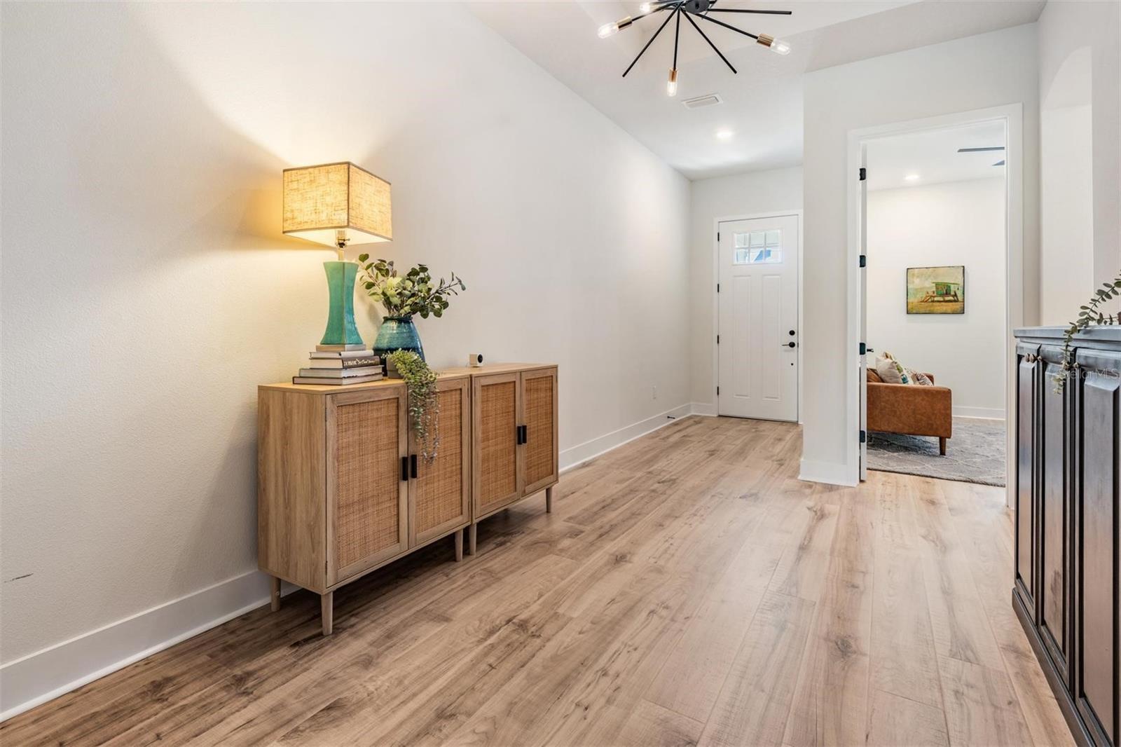 Entry foyer with designer lighting