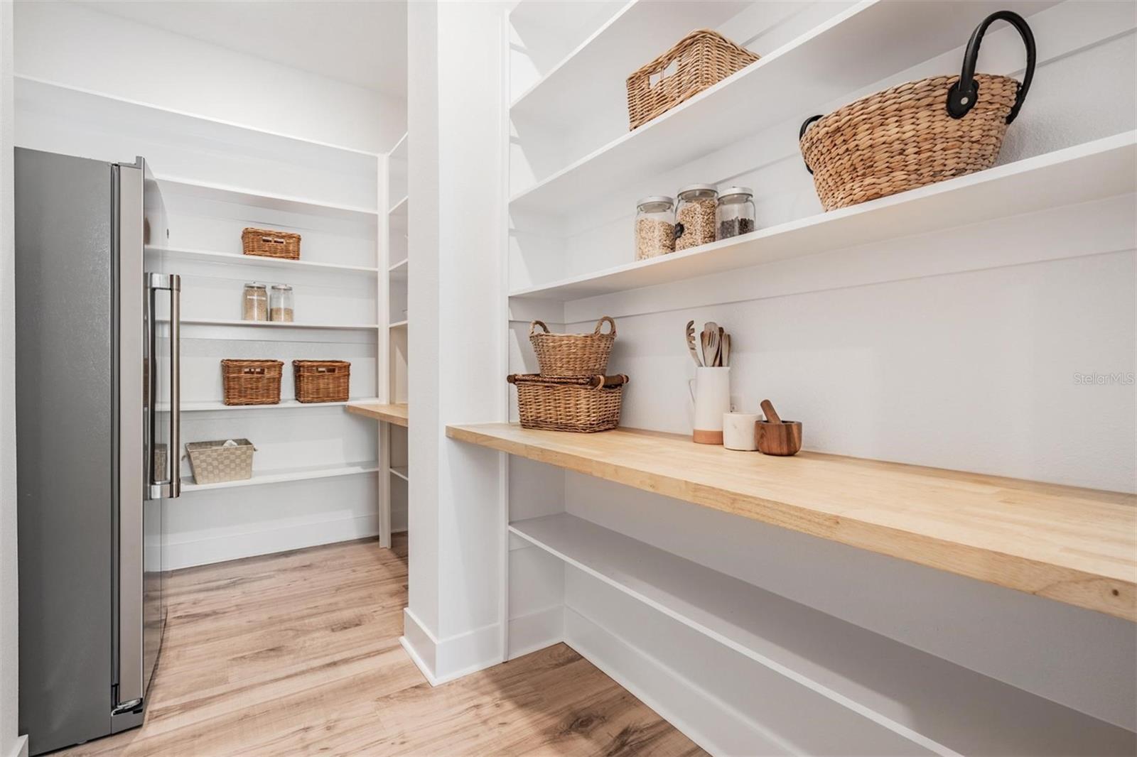 Extensive shelving for additional storage options in the Butler's pantry