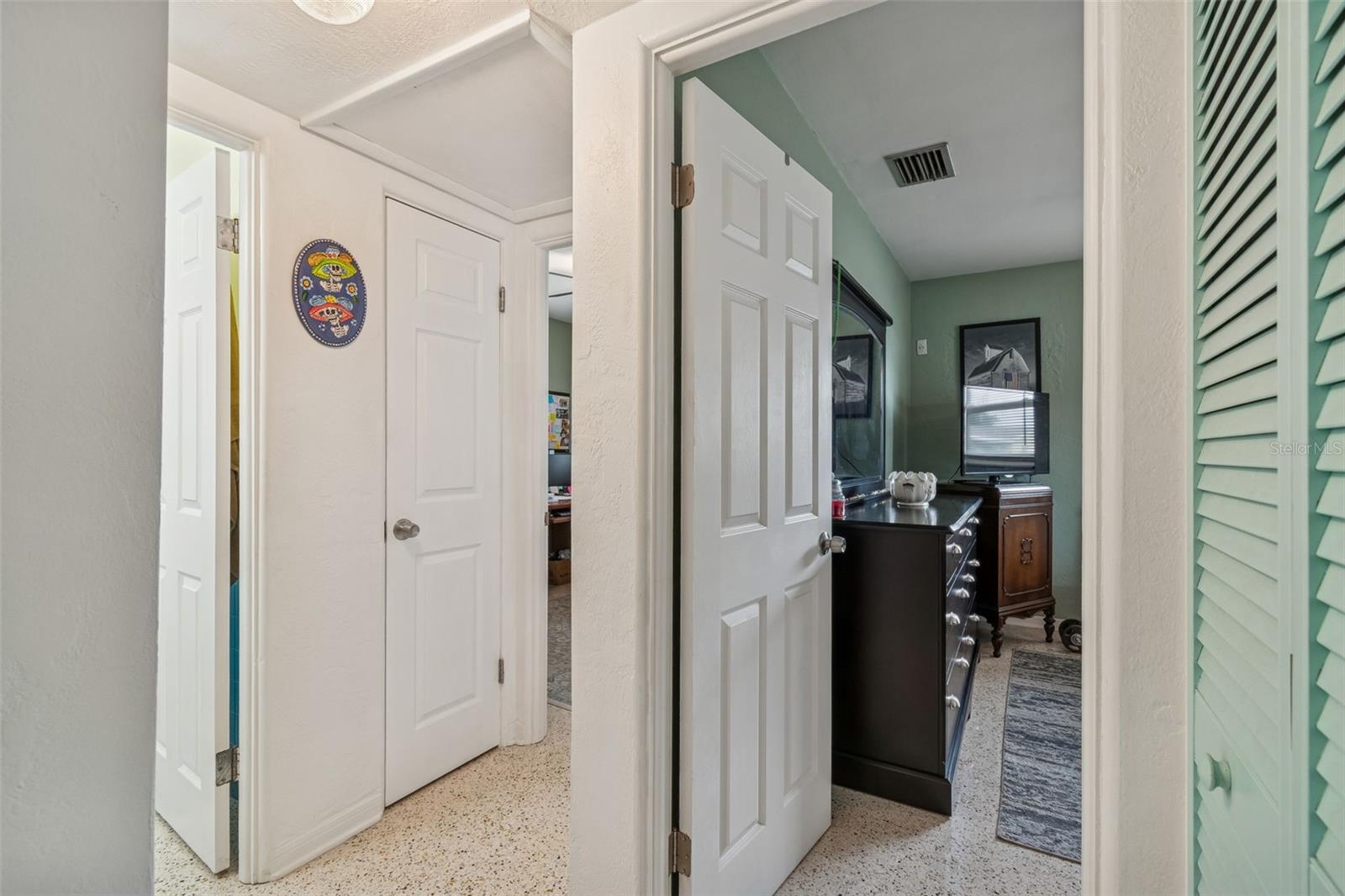 Hallway to both bedrooms located on Right side of home.