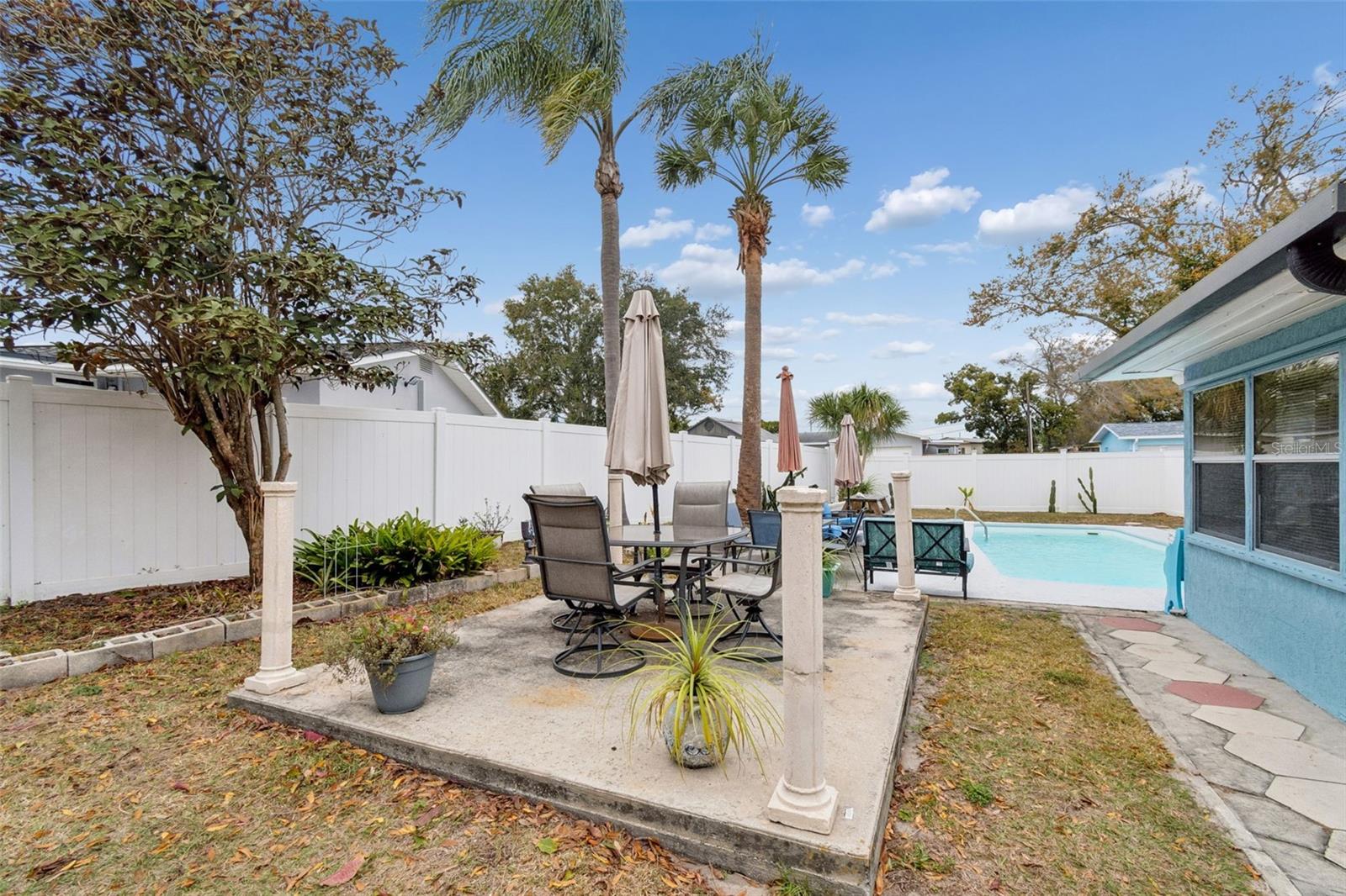 Patio next to pool.