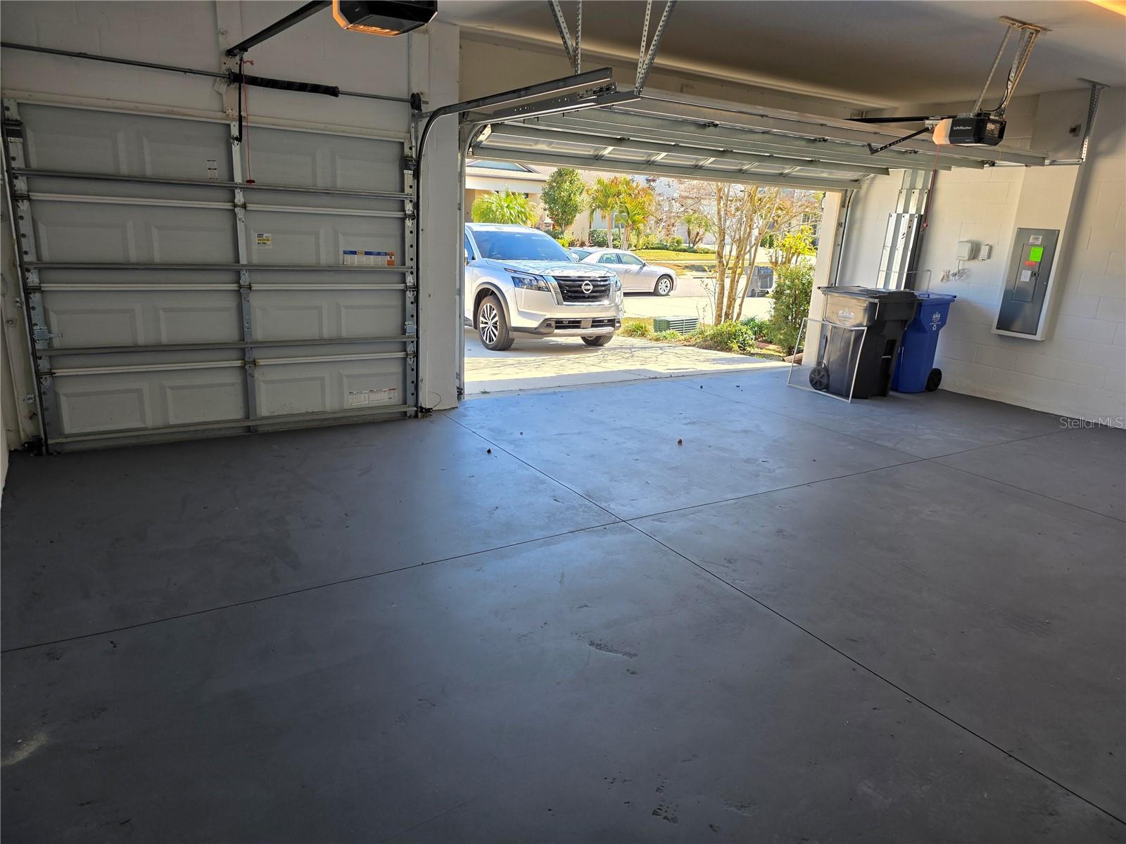 Three car garage, with epoxy treatment on the floor...