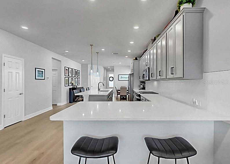 Cooks kitchen with 42 ich cabinets and double breakfast bar for maximum family enjoyment!