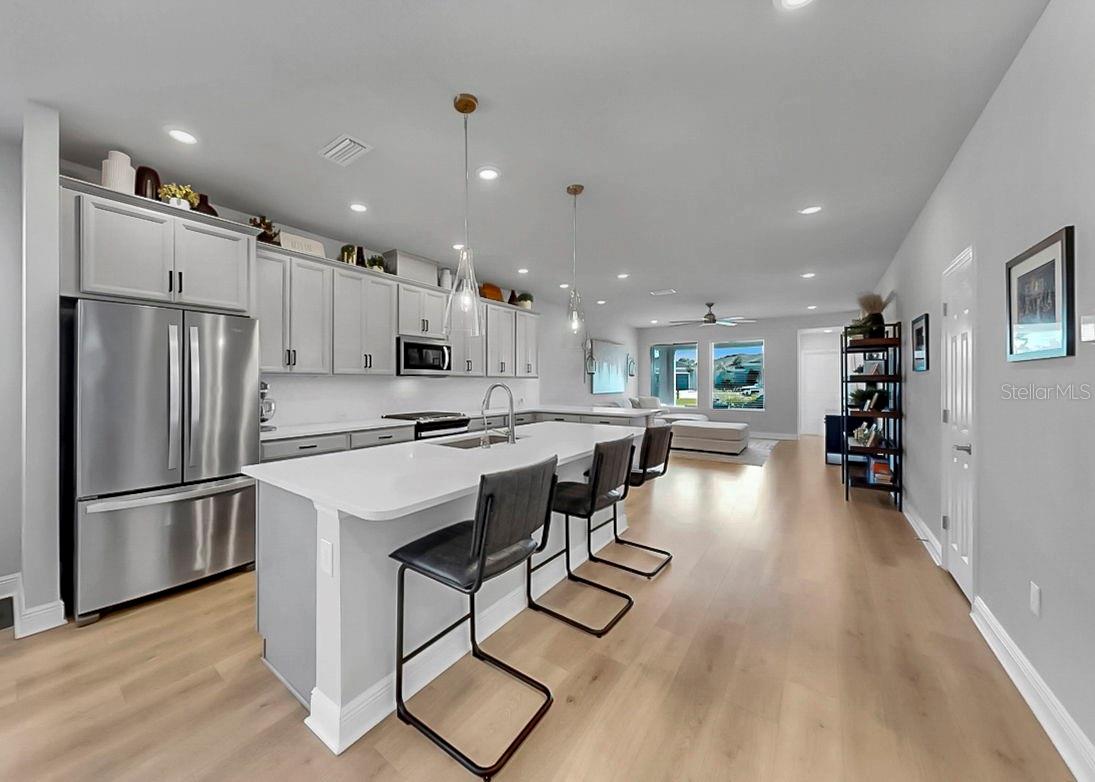Cooks Kitchen with Breakfast Bar and open plan into family room