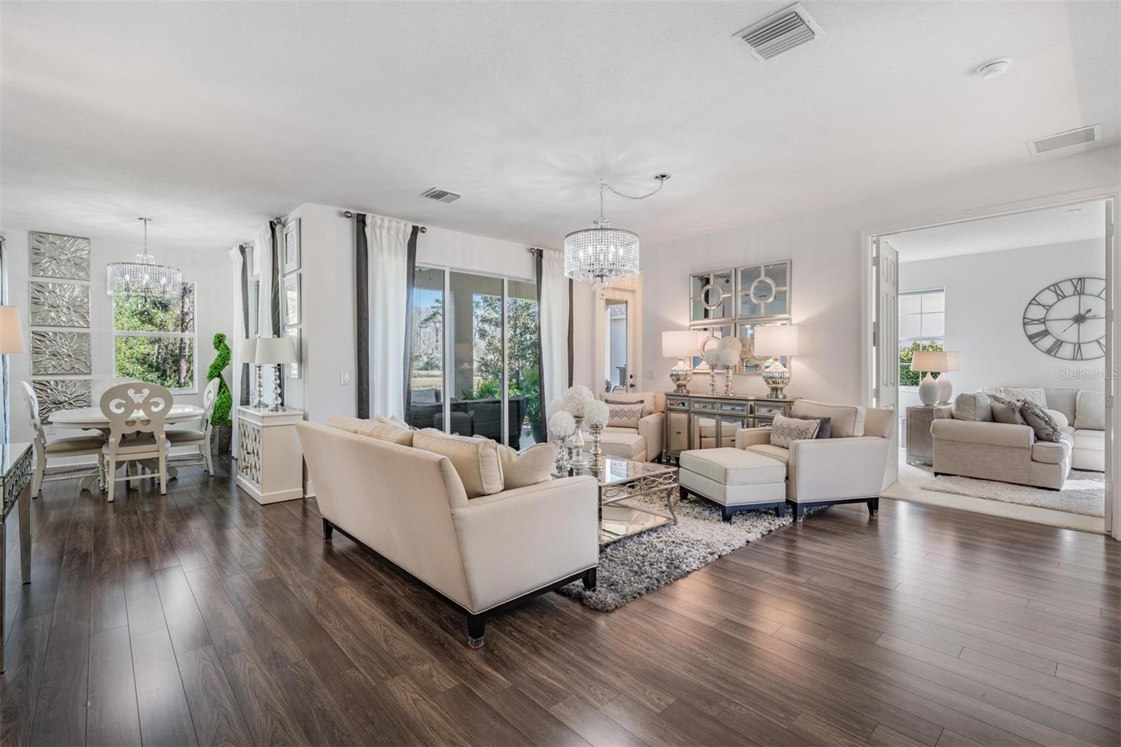 Formal Living w/gorgeous flooring & updated lighting