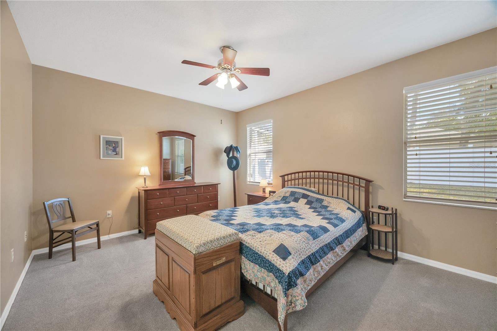 The private primary suite is a true retreat with a 12' x 7' walk-in closet .