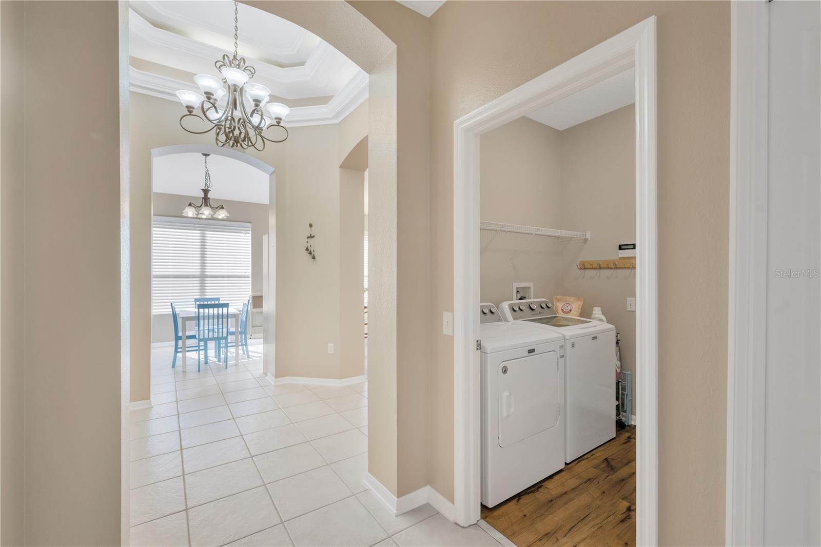 Inside utility room with gas & electic dryer connections.  Washer & Dryer (Electric) convey to buyers.