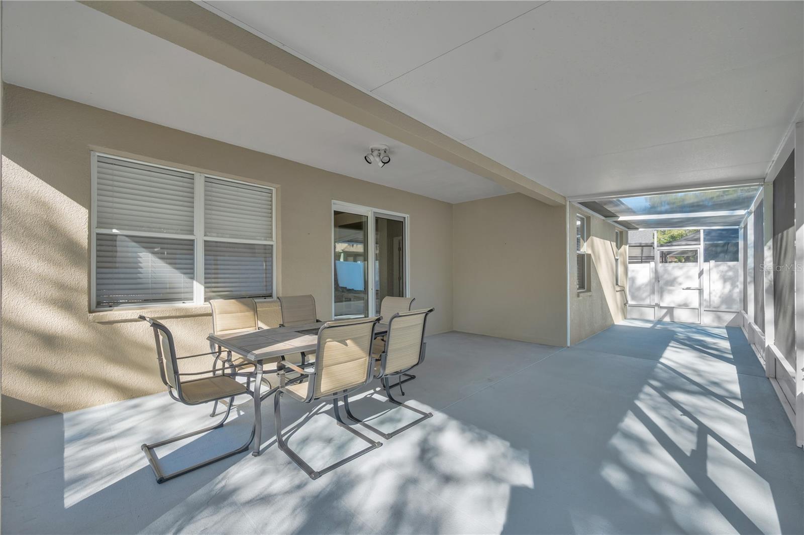 Screened and partially covered lanai just off of Living Room.