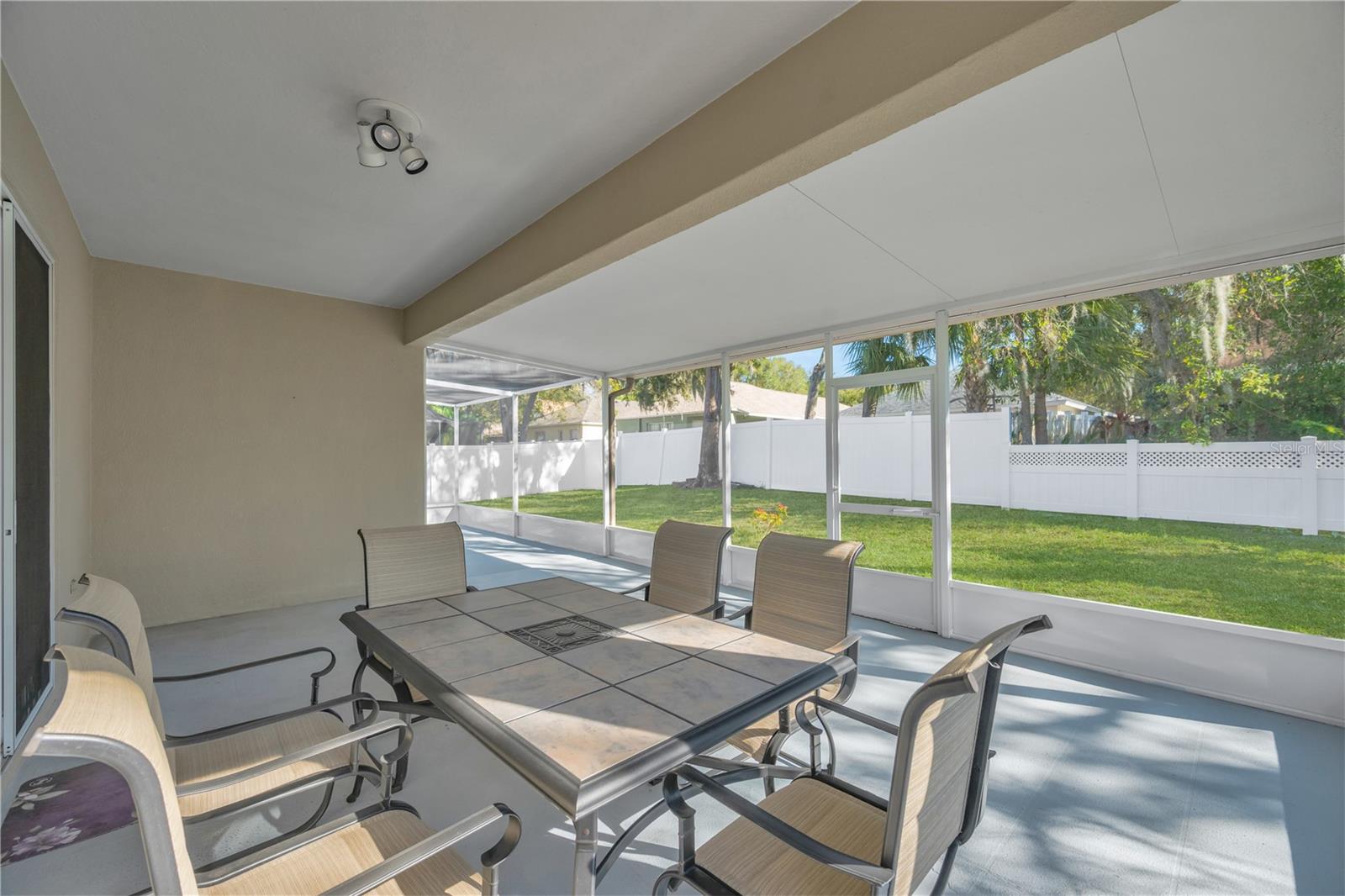 The fenced yard provides endless possibilities for gardening, entertaining, and outdoor fun.